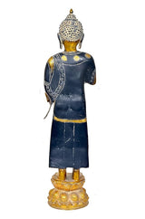 Brass Buddha idol statue from back, dark blue robe with gold trim, jeweled head