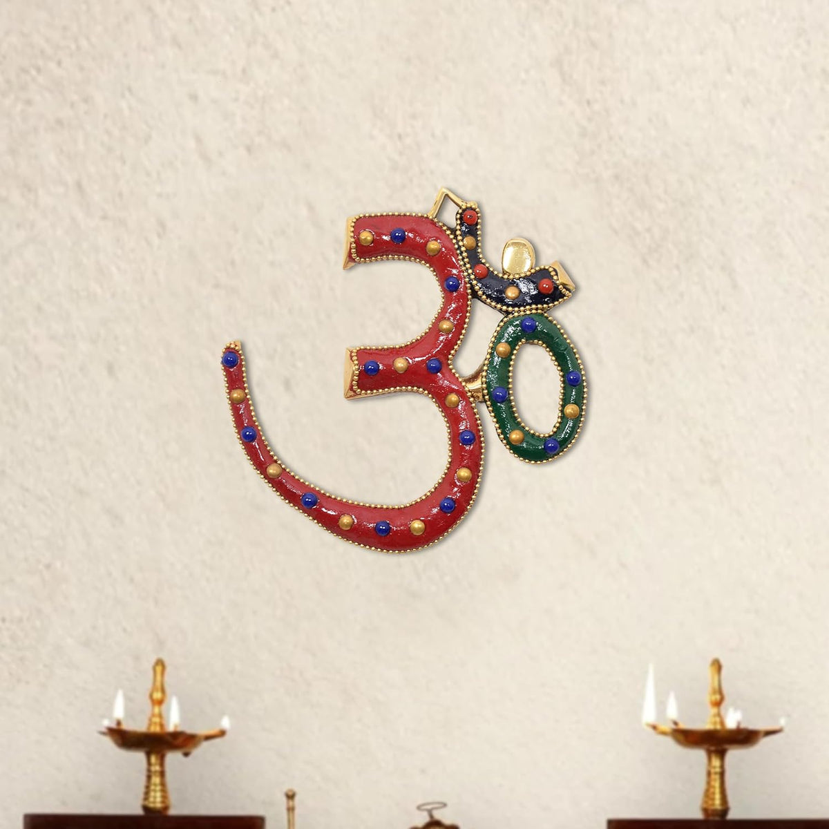 Brass OM wall hanging with red base, blue beads, gold trim, and green inner 0