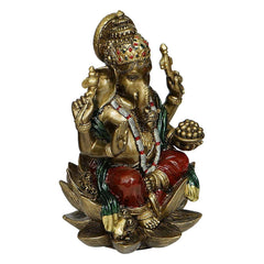 Seated Ganesha statue with green drape and glossy red legs, four arms raised