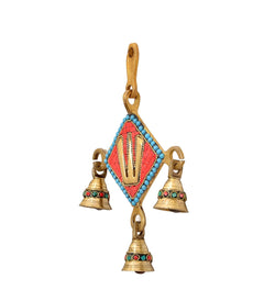 Brass Balaji wall hanging idol from angled view with red-blue diamond center and bells