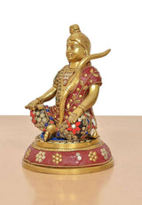 Brass Ram Lala seated statue side profile, holding bow/rod, detailed beadwork costume