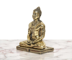 Brass Mahavir Jain idol, side view, ornate headpiece and seated pose, 5 inch
