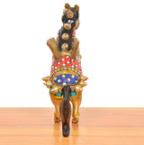 Brass winged flying horse statue, back view with decorated harness and upright head