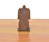 Copper guru idol back view, tall rectangular backrest and pedestal base.
