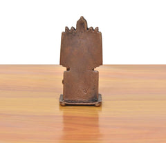 Copper guru idol back view, tall rectangular backrest and pedestal base.