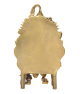Golden brass back of seated Ganesha idol with decorative halo shape