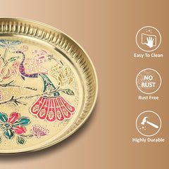 Close-up of brass thali rim with peacock meenakari pattern on the base