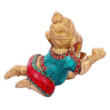 Brass Lord Ganesha idol seated, turquoise and red patterned garments with ornaments