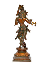 Brass Krishna statue back/side view, flute held out, patterned robes, carved base
