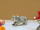 Superfine brass Nandi bull figurine with raised horns and detailed armor-like saddle