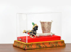 Laddu Gopal Krishna decorated box, clear cover view with balti and silver pichkari