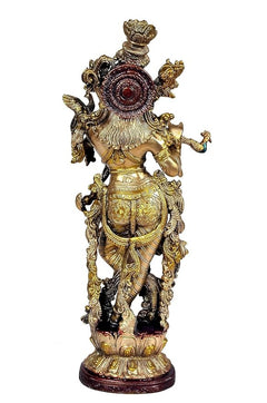 Back view brass Krishna statue idol, circular emblem on chest and detailed back ornaments