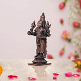 Copper Dhanvantari statue three-quarter angle, four-armed form with adornments
