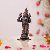 Copper Dhanvantari statue three-quarter angle, four-armed form with adornments