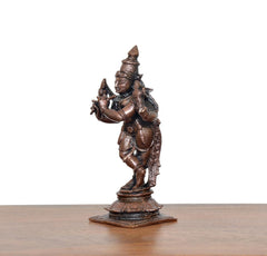 3/4 view copper-bronze Krishna playing flute figurine with detailed ornaments