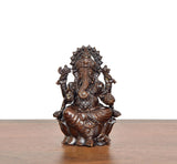Lord Ganesha brass idol from front, seated posture with detailed jewelry and crown