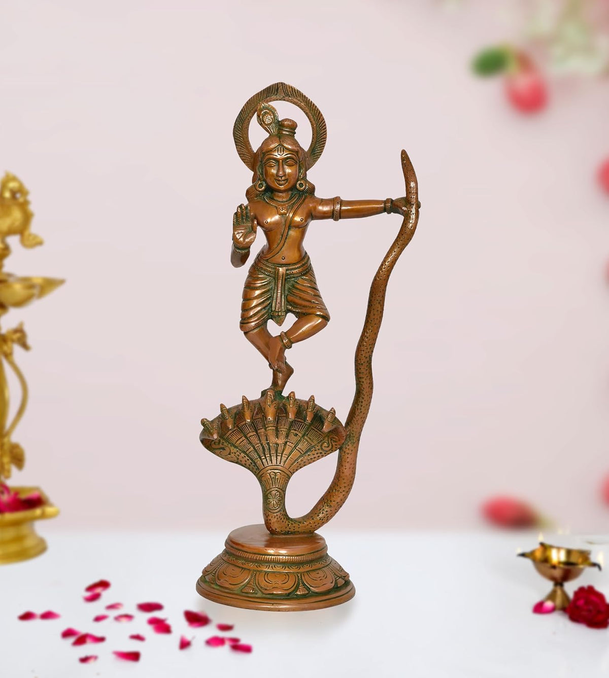 Brass Krishna dancing on Kaliya Naag figurine, ornate halo and serpent tail