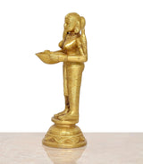 Brass Lakshmi deepam diya, side view with bowl raised, gold-tone metal figurine