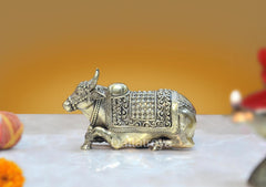 Brass Nandi bull statue with ornate saddle and engraved details, side view