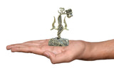 Brass Lord Shiva trishul and damru showpiece held in a hand