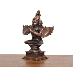 Copper Garun Bhagwan idol side view, extended arms, detailed wings, pedestal base