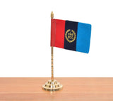 Brass tabletop desk flag with tricolor banner and gold NNC crest, angled