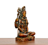 Superfine Brass Lord Shiva statue seated on decorated base, trident held upright, facing left