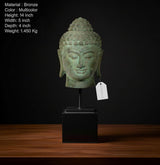 Patinated bronze Buddha head idol on stand, front view with hanging tag