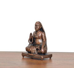 Copper Raghavendra Swami statue, side view seated on carved round pedestal