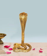 Brass Naag Dev Lord Shiva snake figurine with upright cobra hood and coiled base