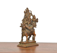Copper Shiva Parvati statue on Nandi idol, side view with trident pose
