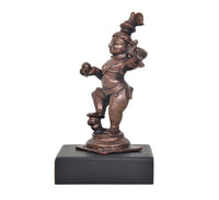 Copper Bal Krishna dancing figurine statue, side view, 4 inch on black pedestal