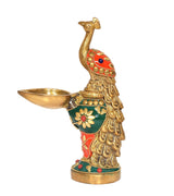 Brass peacock diya figurine with open oil cup, blue eye and green-red body