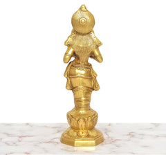 Golden brass Apsara lady figurine holding an oil lamp, back view