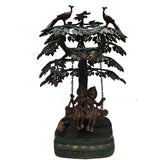 Brass Krishna and Radha swing under tree with peacocks, hanging chains, round base
