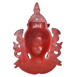Red resin Shiva head wall hanging mask, back view with carved outer edges and hanging loop