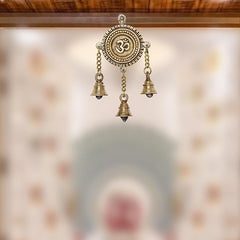 Brass Om wall hanging with three bell charms and circular Om medallion