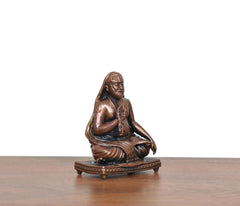 Copper Raghavendra Swami statue, seated profile with joined palms and draped robe