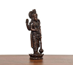 Brass Lord Vishnu idol angled view, draped skirt details and carved base