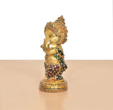 Brass Baby Ganesha sculpture with Meenakari accents, rear side view