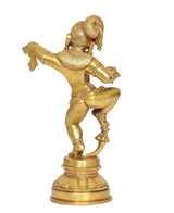 Rear 3/4 view of brass-tone dancing baby Krishna statue, curved arms, round base