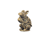 Brass mini mouse idol statue holding a small modak pot, side view