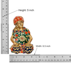 Brass music figurine, 5 in height; 6.5 in width, red-green painted dress