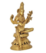 Handcrafted brass Saraswati statue angled view, holding veena with decorative pedestal