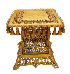 Brass table showpiece, 15-inch height, ornate top with carved panel and hanging bells