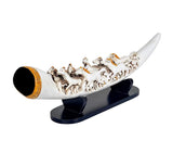 Resin tusk showpiece featuring seven running horses, white resin with brown-gold inlay.