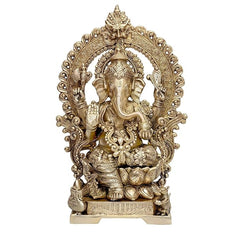 Brass Ganesha seated on lotus with carved ornate frame and kirtimuka, 18 in