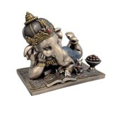Baby Reading Ganesha resin idol close to book, hand poised over pages, seated