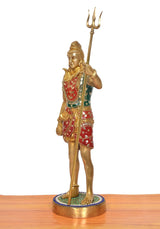 Standing Bholenath brass murti with trident raised, multicolored decorated cloth
