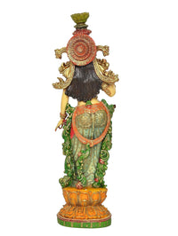 AONA Radha murti idol back view showing crown, braided hair, and layered garment details